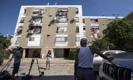 Israeli journalists report outside the apartment building of Avera Mengistu in Ashkelon. His disappearance was revealed after the Haaretz newspaper challenged the gag order in force since his disappearance 10 months ago.