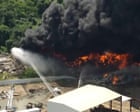 Warehouse fire sends black smoke across Houston sky – video
