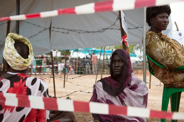 Women wait in line for food distribution at the UN Protection of Civilians site in Tomping, South Sudan