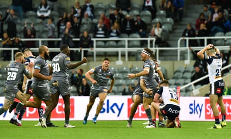  The Catalans Dragons players celebrate James Maloney’s winning drop goal in extra time. 