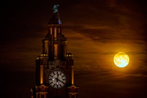 The first supermoon of the year, the strawberry moon, rises over Liverpool, UK