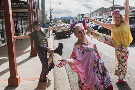 Three of the Kyogle Happy Dance committee members dancing on the main street in Kyogle, NSW.