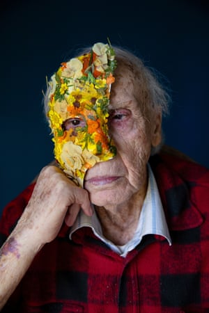 Transparent Curtains, 2023Mordechai Zilberman sits wearing his precocious partner Aryeh’s clothes, holding a flower-decorated mask. The 2 men were together for 60 years. After moving to a nursing home, he concealed his sexuality, fearing rejection from different residents and staff. This image is portion of a bid by photographer Oded Wagenstein, who worked pinch LGBTQ+ elders. The mask, made by Wagenstein, represents this enactment of hiding.