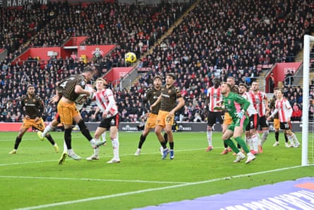 Charlie Hughes heads in Hull’s decisive second goal at Southampton through a crowded penalty area.