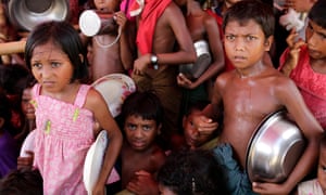 Rohingya children queue to collect food in a refugee camp in Ukhiya, Cox’s Bazar, Bangladesh. the World Food Programme has withdrawn a critical report on hunger in Myanmar at the request of the government.