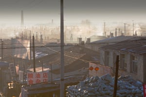 Suihua, China: Heavy use of coal in a slum in Suihua, Heilongjiang, pumps out smoke into an already highly polluted atmosphere. Rates of heart and lung disease, and breathing difficulties are commonplace in Chinese cities, that are among the most heavily polluted in the world.
