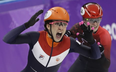 Suzanne Schulting of the Netherlands celebrates as she wins the women’s 1000 meters short track speedskating final