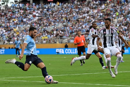 Rayan Cherki crosses the ball
