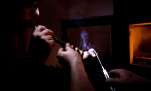 Iranians smoking opium