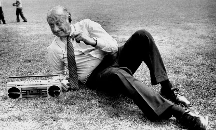 Ed Koch listens to music in Central Park.