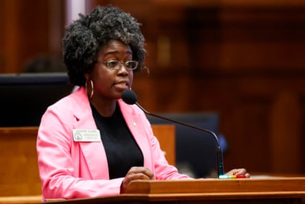 Woman stands at lectern