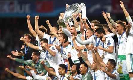 Real Madrid celebrate after winning the 2018 Champions League final against Liverpool, completing a hat-trick of triumphs.