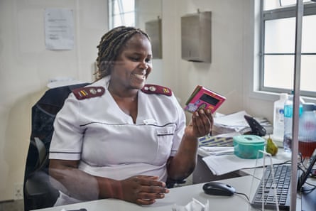 Likelili Motia, a nurse at the Magadla Clinic, outside Matatiele in the Eastern Cape, listens to the English version of the talking book, which they will use to help patients who will be initiated on antiretroviral therapy.
