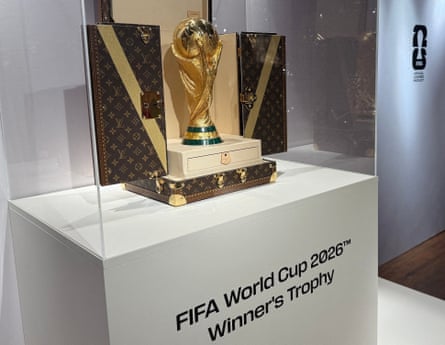 A World Cup replica trophy is displayed in a Louis Vuitton case.