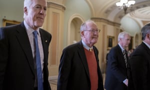 John Cornyn walks with Lamar Alexander as senators leave the chamber after voting to recess during the impeachment trial of Donald Trump.
