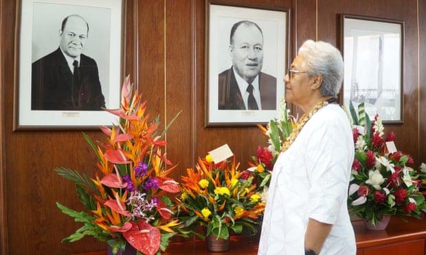 Fiame Naomi Mata’afa looks at the images of former prime ministers on the wall of her office, including that of her late father, the country’s first PM.