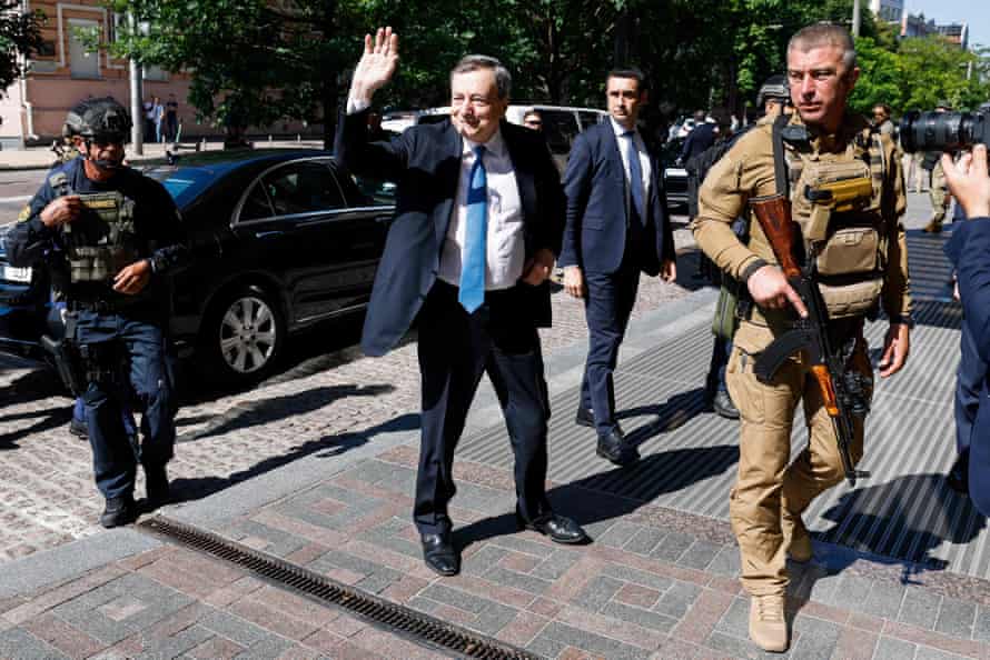 Italian Prime Minister Mario Draghi (C) arrives at his hotel in Kyiv.
