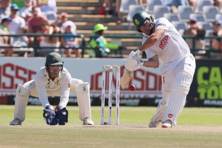 South Africa’s Ryan Rickelton plays a shot as Australia’s wicketkeeper Alex Carey looks on