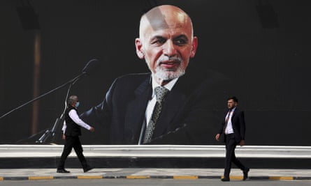A mural of Ashraf Ghani hanging at Hamid Karzai international airport