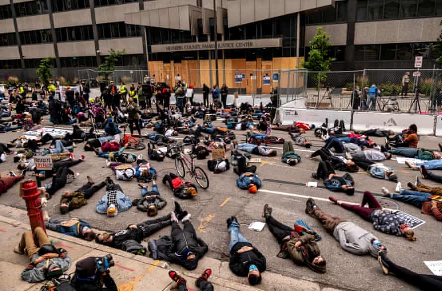 Demonstrators stage a die in outside the Hennepin county family justice center on 11 September 2020 in Minneapolis, Minnesota.