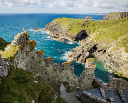 The remains of the castle on a rocky headland.