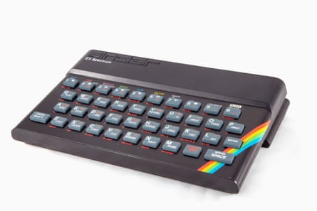 A black computer keyboard is shown with a bright rainbow coloured stripe on one side.