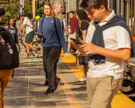 Passengers get off a train at Palo Alto station