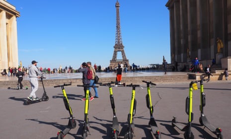 Electric e-scooters on the Place du Trocadero, with the Eiffel Tower in the background