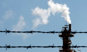 Emissions are released from a factory chimney