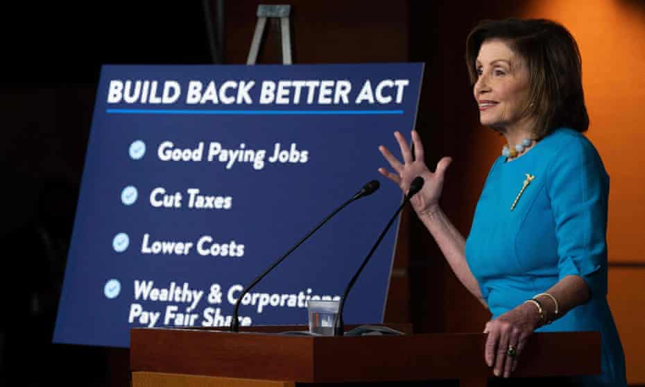 Nancy Pelosi, House speaker, speaks on the Build Back Better Act during her weekly news conference. A board next to her highlights the main points of the act.
