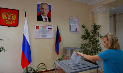 A voter casts her ballot at a polling station during local elections held by the Russian-installed authorities in the course of Russia-Ukraine conflict in Donetsk, Russian-controlled Ukraine, September 9, 2023.