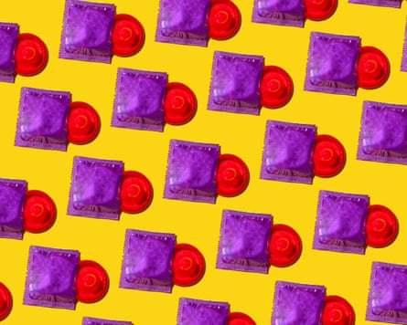 A multitude of red condoms half removed from their purple packet on a bright yellow background