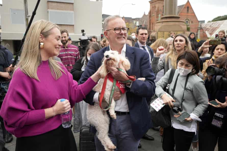 Anthony Albanese holds his dog Toto after he and his partner Jodie Haydon voted in Marrickville