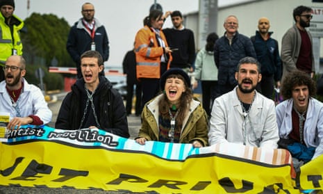 Climate activists from Extinction Rebellion, Scientist Rebellion and Last Generation block the entrance of an airport facility in Milan