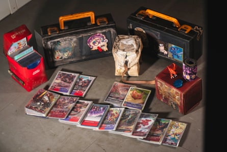 Among the belongings salvaged by the Yip family are treasured collectible game cards. Some protective boxes melted and warped in the blaze, yet Yip was surprised that these companions — which had been with him from childhood through adulthood in Wang Fuk Court — survived the deadly fire that killed 168 people.
