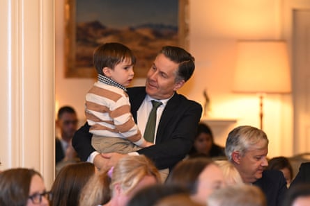 Butler holds his youngest son Charlie Dominic during a swearing-in ceremony in 2025.