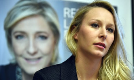 Marion Maréchal-Le Pen against a backdrop of a poster of her aunt, Marine Le Pen.