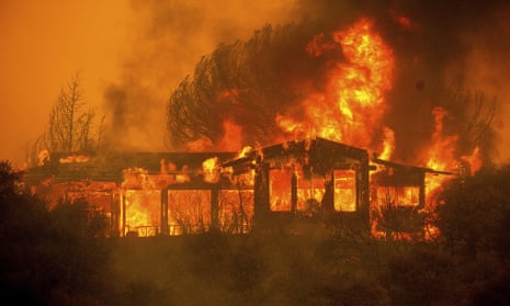 A home burns near Finley, California, on 30 July. 