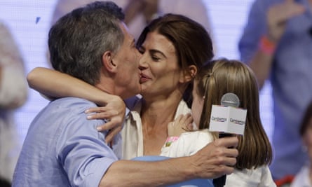 Mauricio Macri, left, kisses his wife Juliana Awada after winning a runoff presidential election in Buenos Aires, Argentina on Sunday.