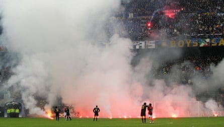 Flares rain down on the pitch as the Champions League quarter-final is abandoned in 2005.