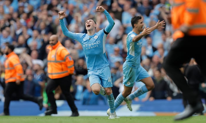 Phil Foden celebrates winning the league,