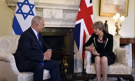 Theresa May and Benjamin Netanyahu sit and talk in Downing Street
