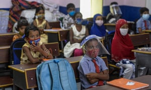 Students attend a class at a government school in Hyderabad on 1 September