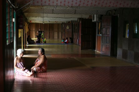 Two women in the communal area inside the Sungai Buri longhouse