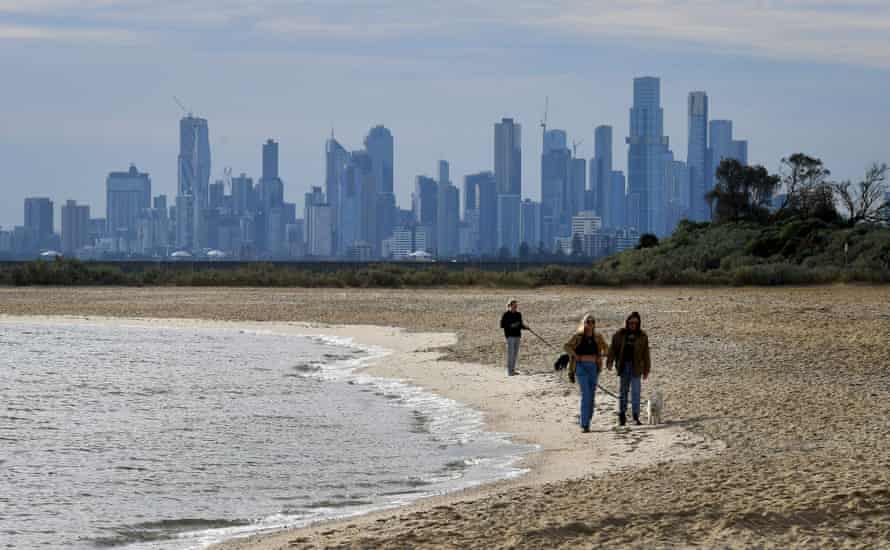 People walking on Melbourne's Brighton beach