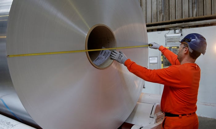 A worker measuring the diameter of a coil of aluminium at the Neuf-Brisach Constellium aluminium products company’s production unit in Biesheim, Eastern France.