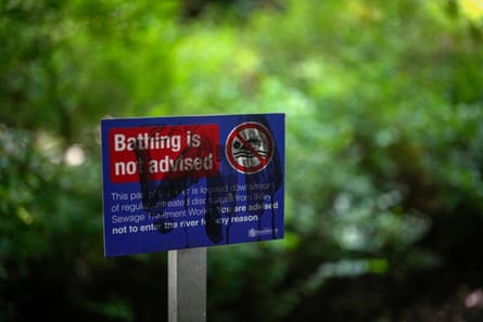 Sign that says the water quality is poor and bathing ''is not advised"