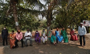 Villagers wait to receives a dose of the Covidshield vaccine manufactured by Serum Institute of India, at a primary healthcare centre in Limb village in Satara district in the western state of Maharashtra, India, 24 March 2021.