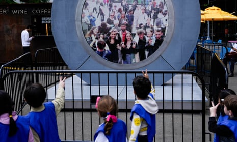 Children in New York City signal to people in Dublin through the livestream Portal