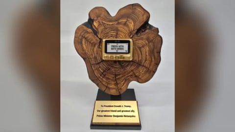 pager attached to wooden plaque